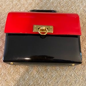 Color block patent leather purse.